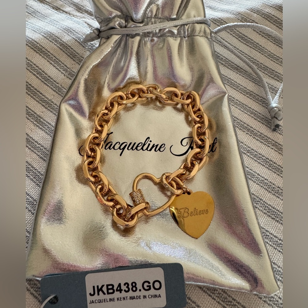 Jacqueline Kent Gold “believe” bracelet with silver pouch! BRAND NEW!!